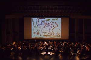 JSO concert featuring student artwork